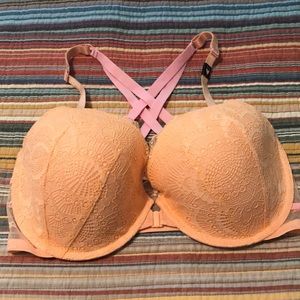 NWT Victorias Secret peach bra with pink crisscross back in size 36DDD. Demi cut